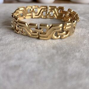 Grecian style Signed Monet Bracelet.Excellent condition.Gold tone nontarnish